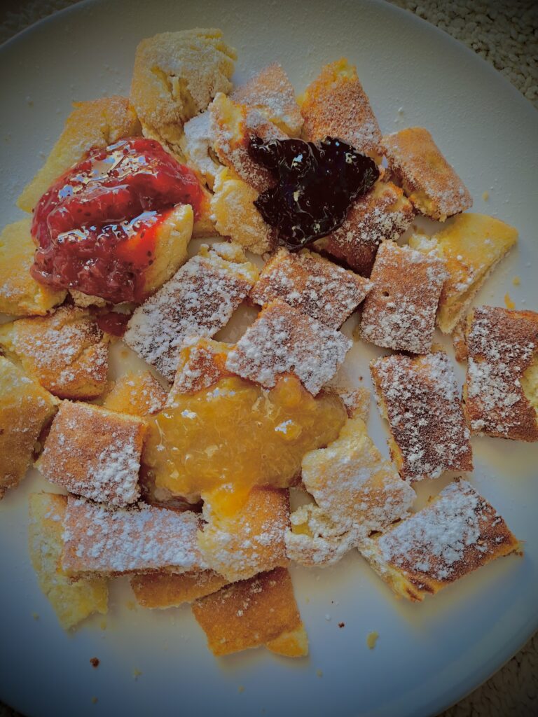 Kaiserschmarrn with powedered sugar and jam